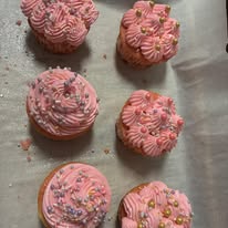 Pink strawberry cupcakes with swirled buttercream and sprinkles