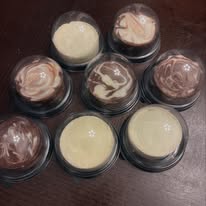 Assorted whipped chocolate and vanilla dessert cups